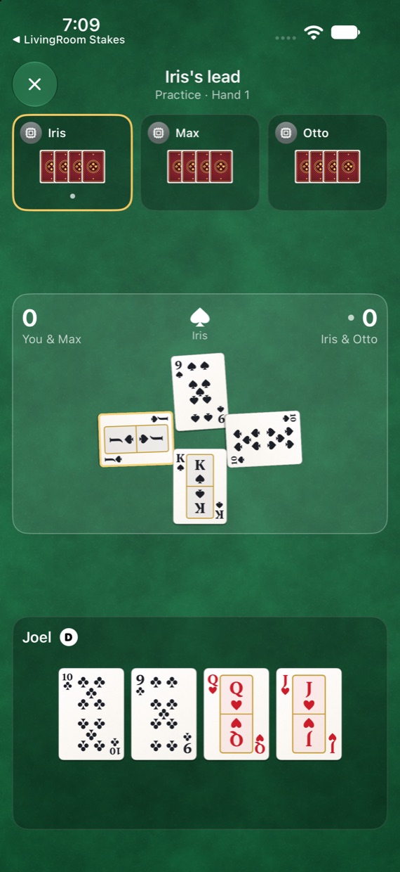 A trick in play: the three other players around the table, four cards in the middle and your hand along the bottom.