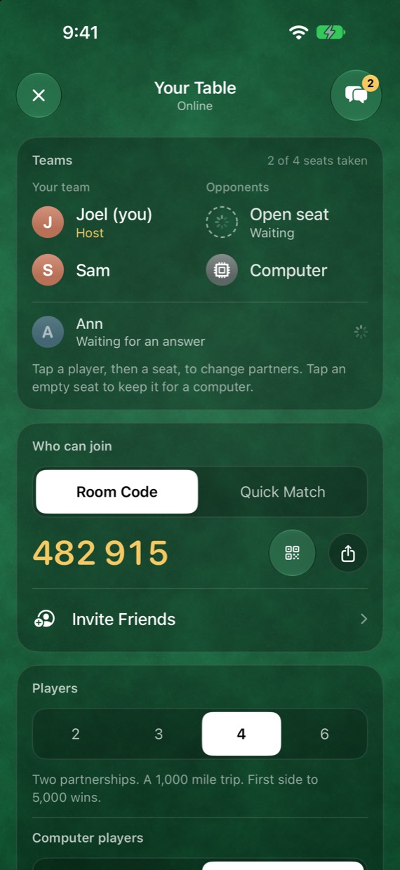 An online table with its six-digit room code, and the players in their seats as two teams.
